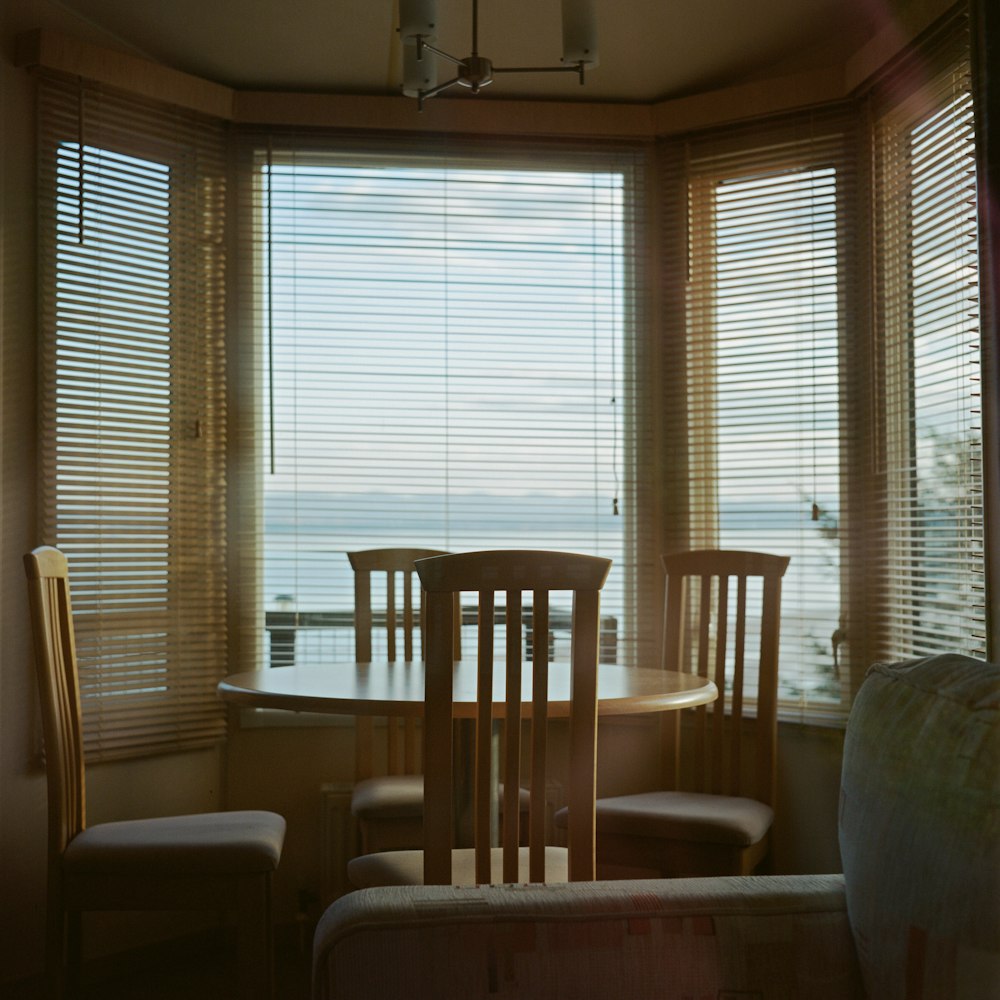 white and brown wooden dining table and chairs