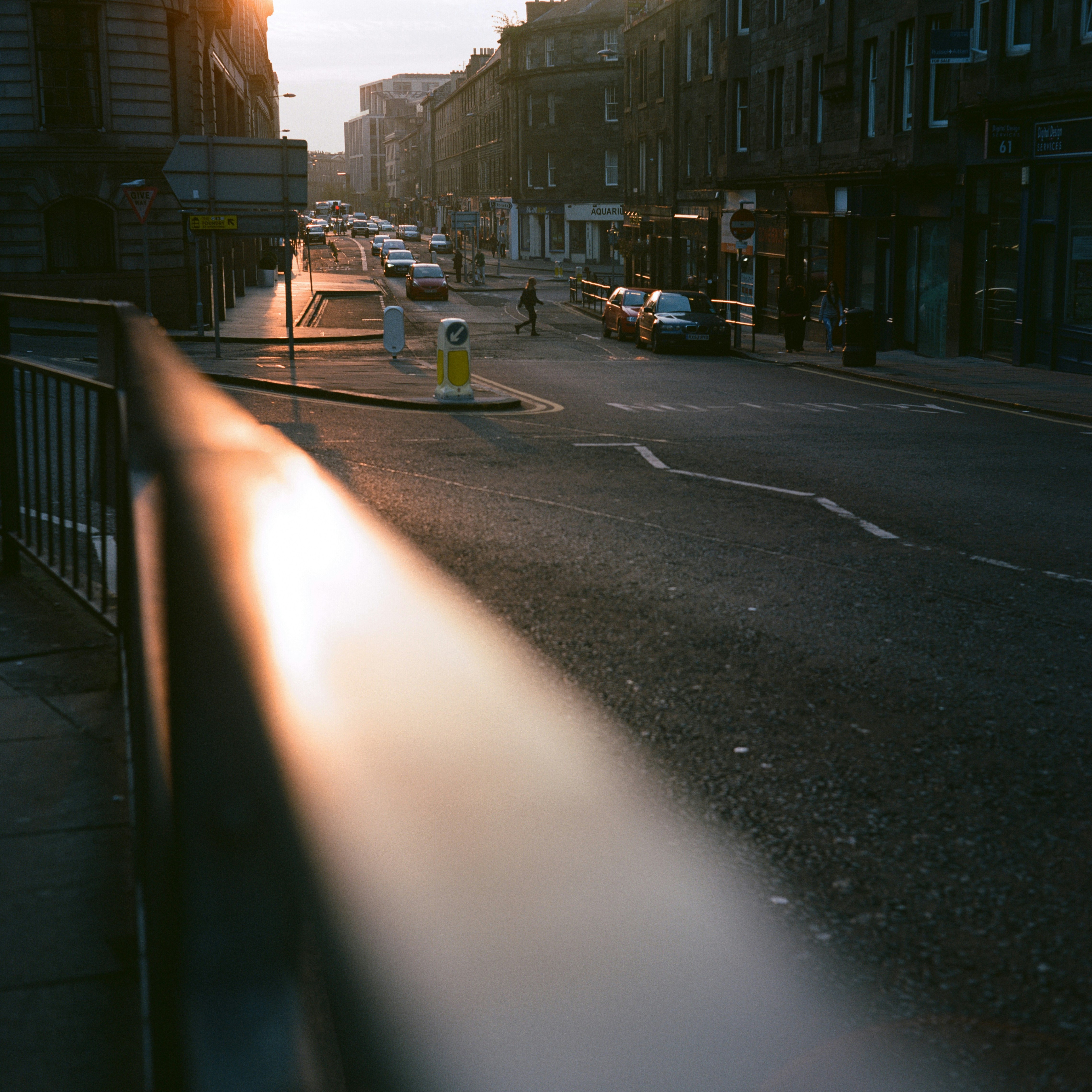 cars parked on side of the road during daytime