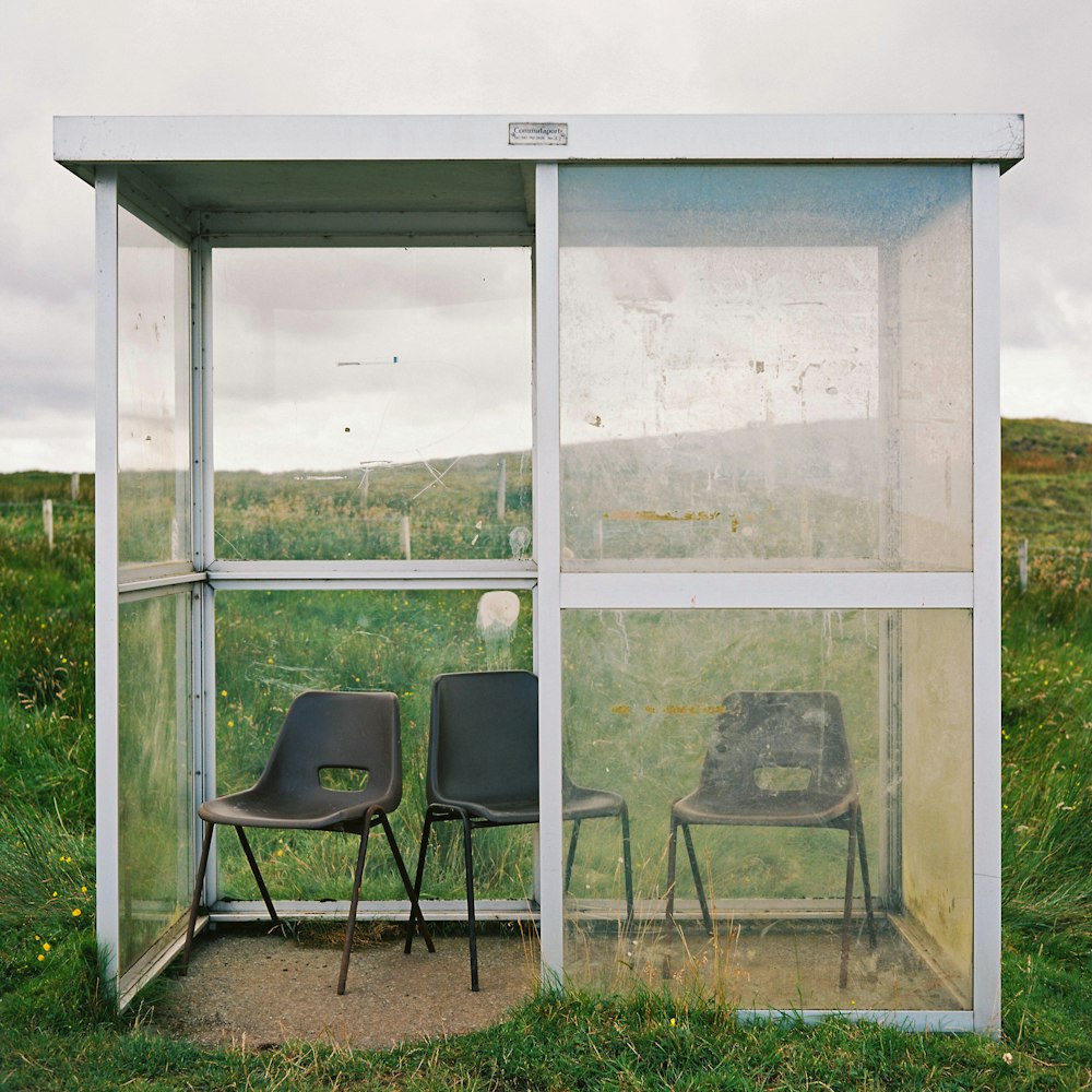 black chair beside glass window