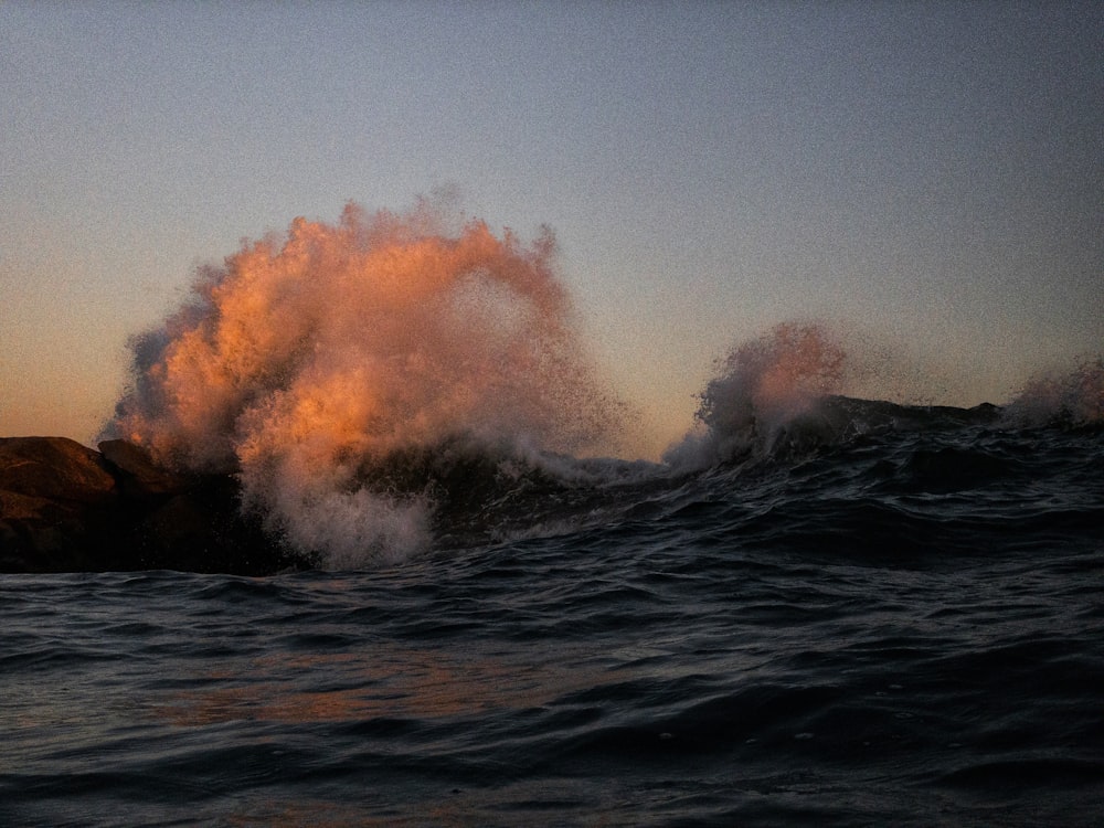 ocean waves crashing on shore during daytime