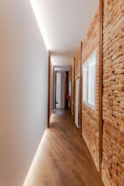 brown and white hallway with white wall