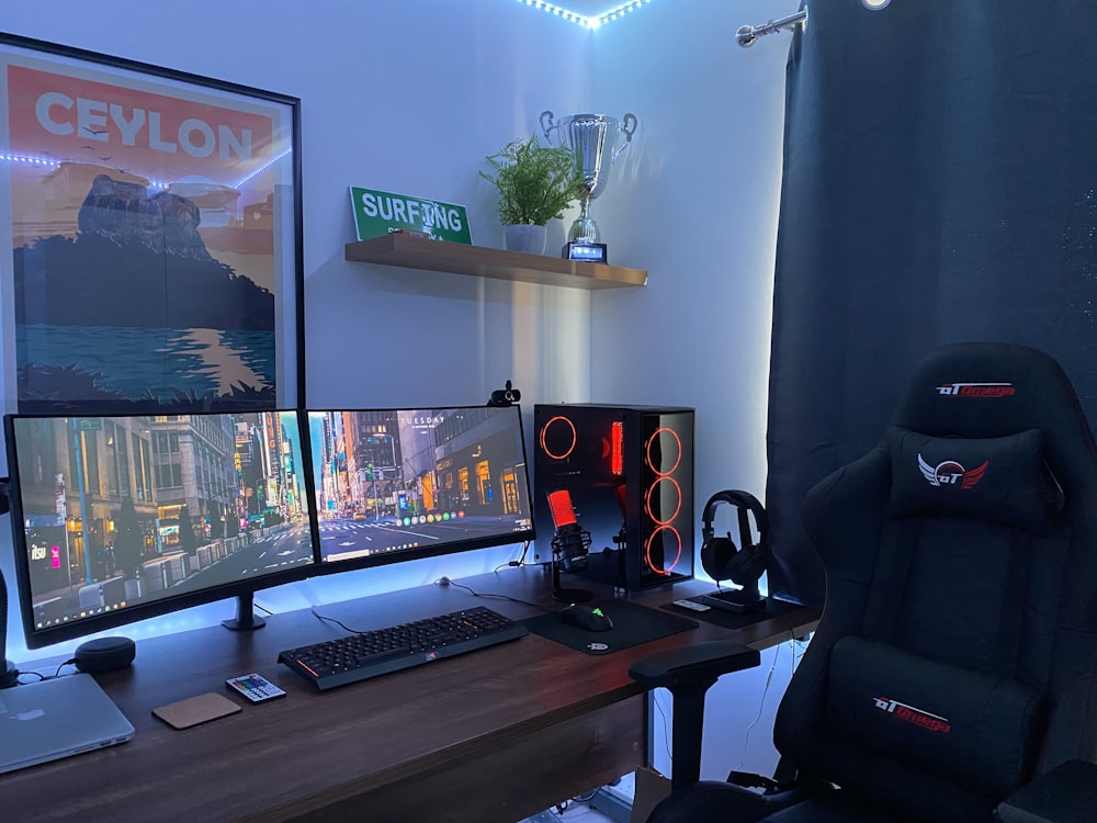 black flat screen computer monitor on brown wooden desk