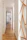 A bright hallway in a rental property showing fresh paint and clean, protected floors.