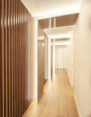 Slat panel installation bringing texture and warmth to a Windermere residential hallway.