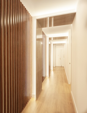 Stylish hallway with dark stained parquet flooring and contemporary wall colors.