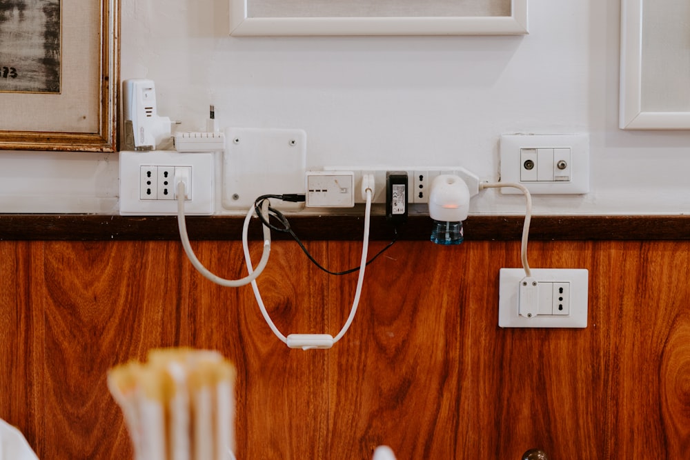 white power strip on brown wooden floor