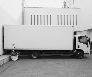 white truck parked near white building