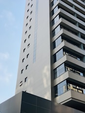 white concrete building under blue sky during daytime