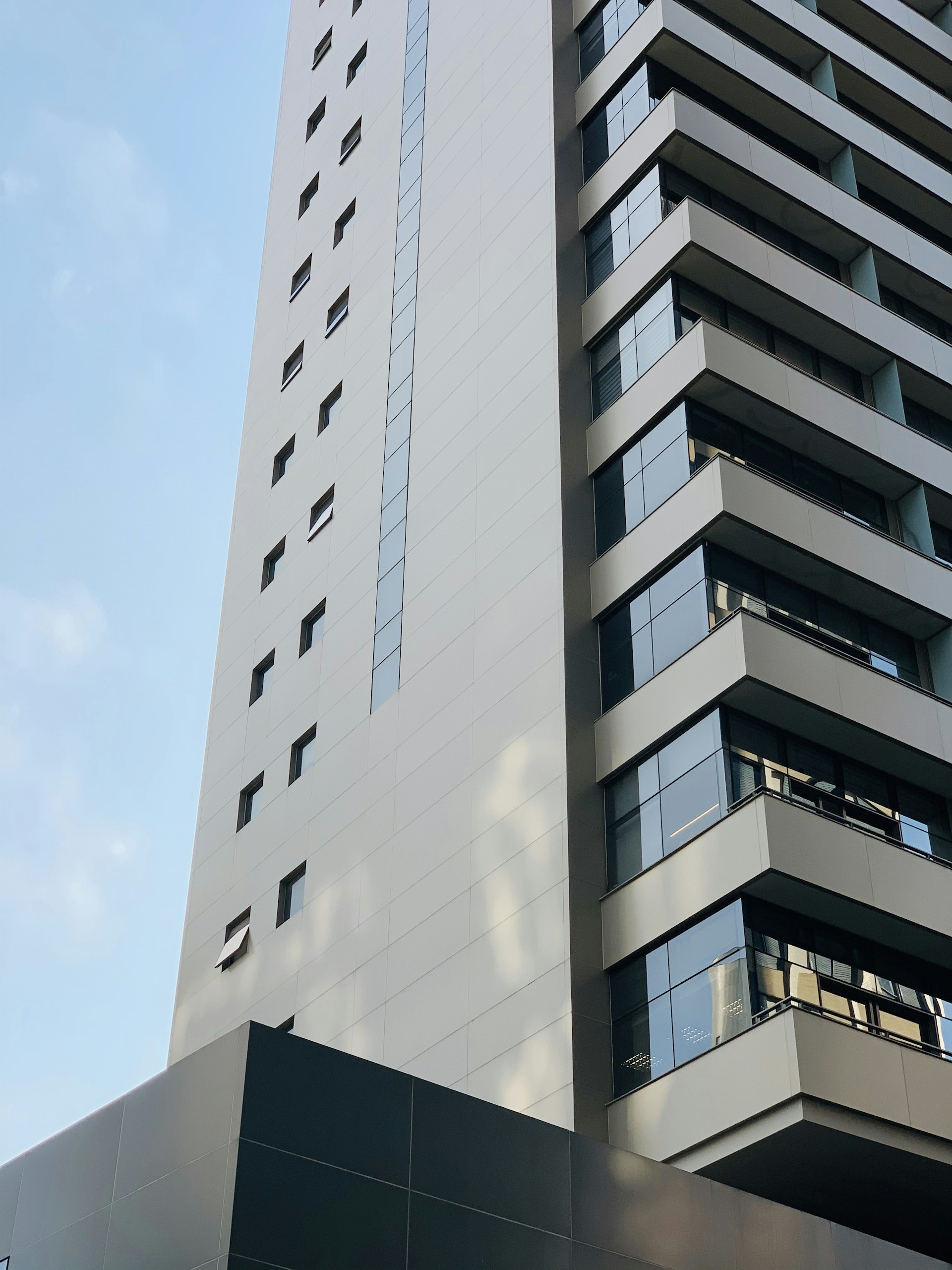 white concrete building under blue sky during daytime