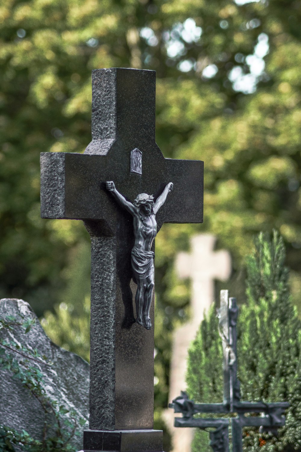 black cross on gray rock