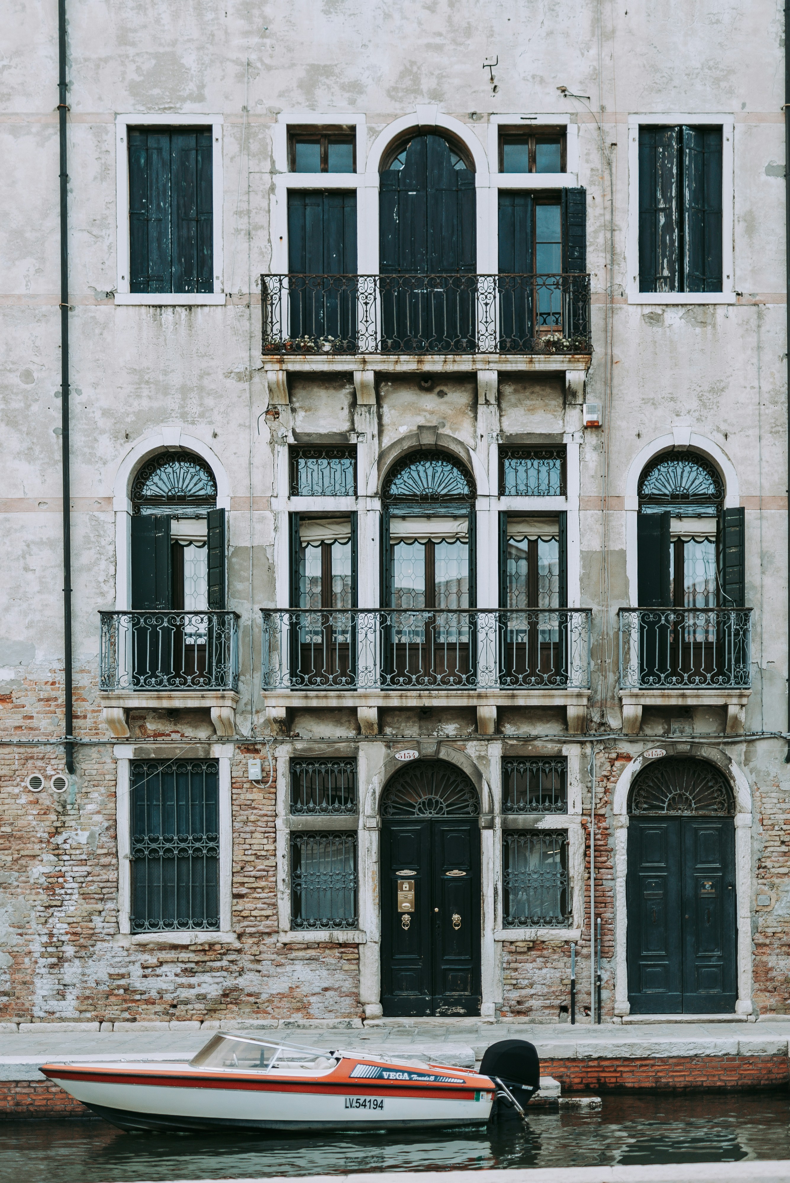 black steel door on brown concrete building during daytime