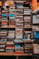 A high load-bearing shelf stacked with heavy textbooks in a multi-functional library corner.