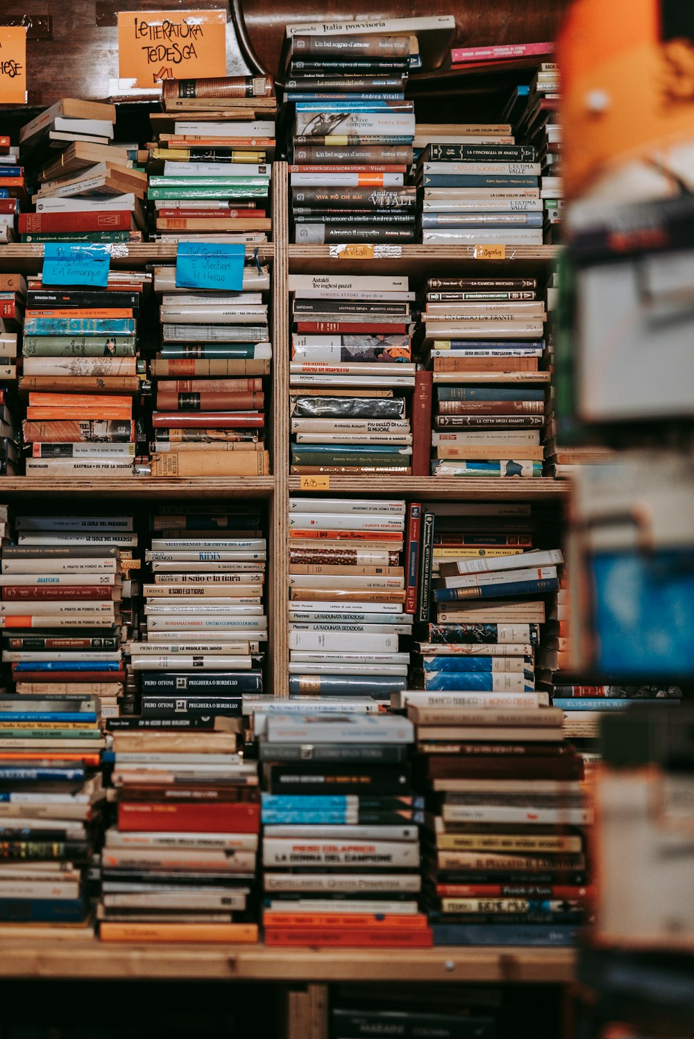 books on brown wooden shelf