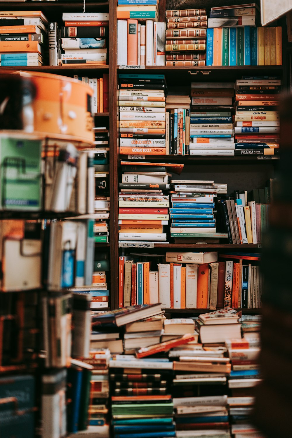 books on brown wooden shelf