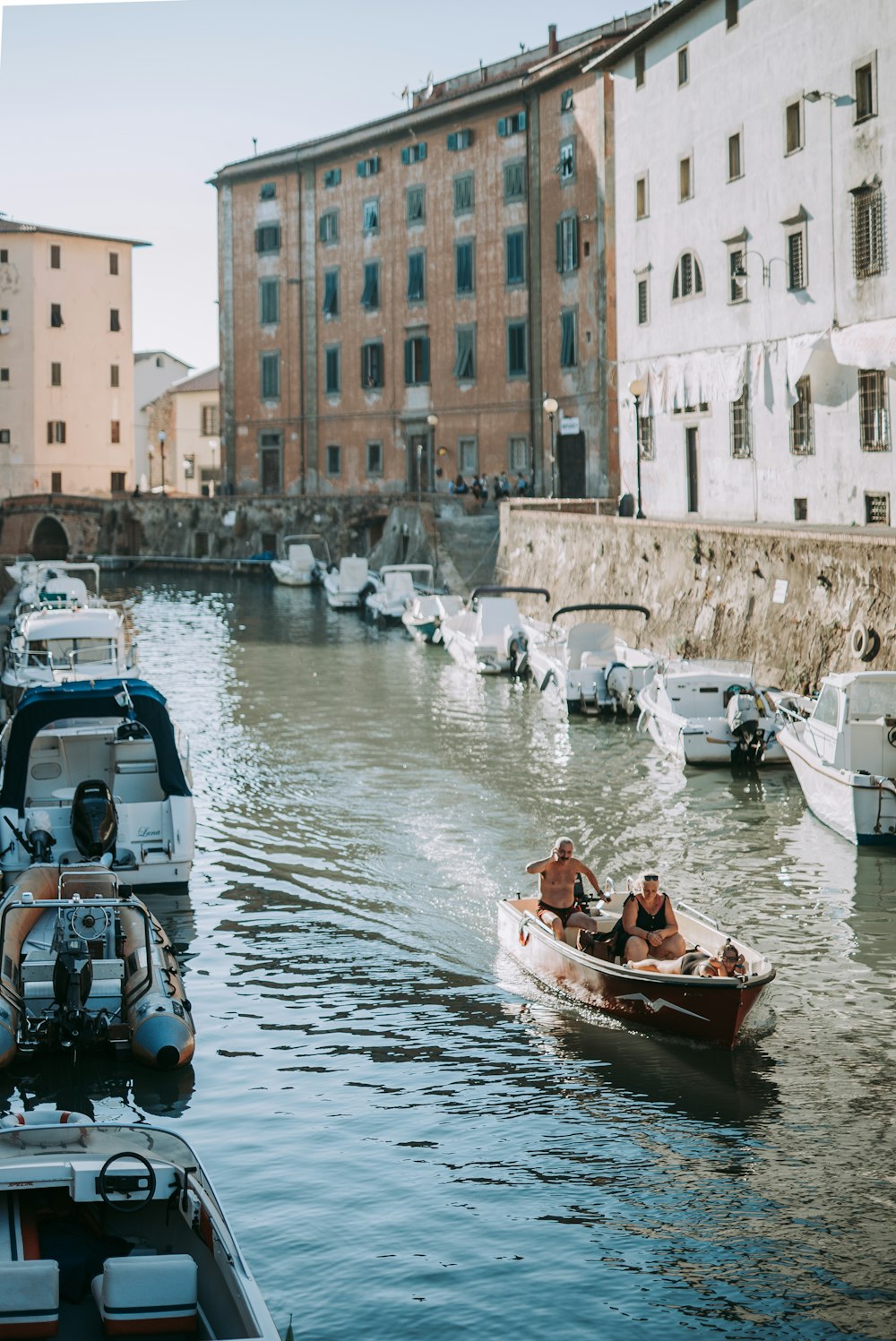 red and white boat on water during daytime