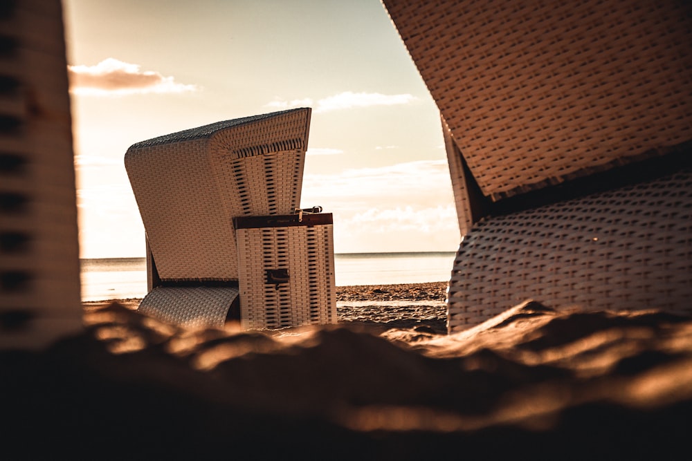 brown wicker chairs on beach during daytime