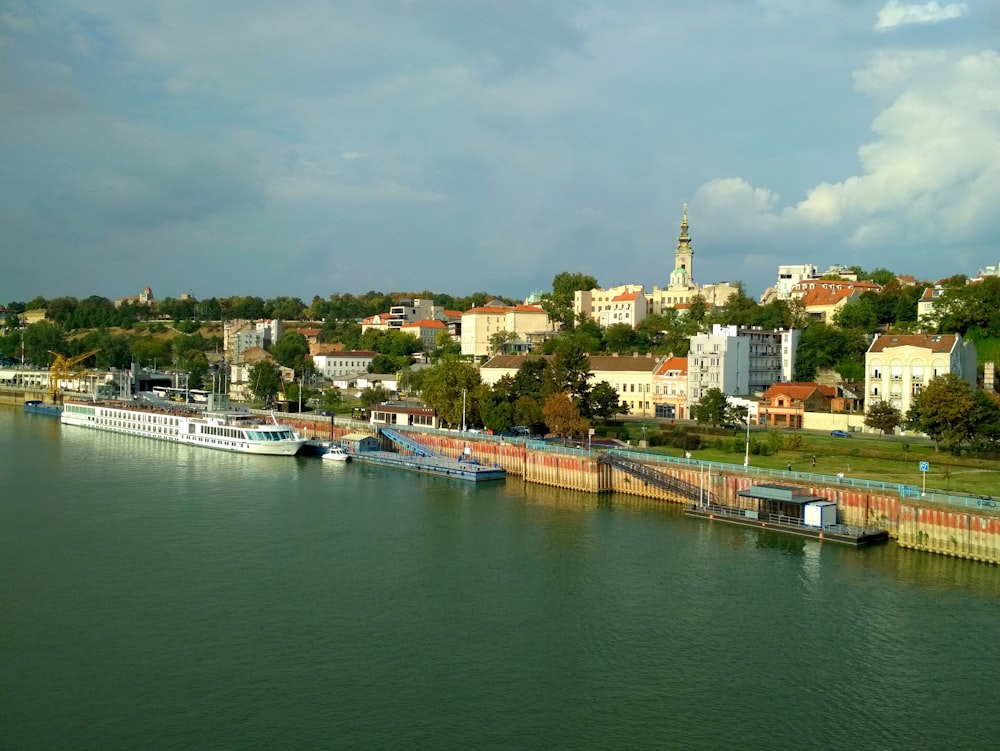 body of water near city buildings during daytime