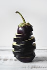 green bell pepper on black and white stripe textile