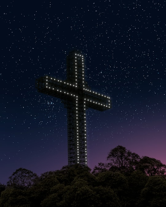 black cross under blue sky during night time in Millennium Cross North Macedonia