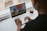A happy customer enjoying online gaming on a laptop.