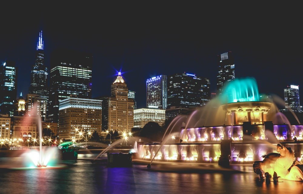 water fountain in the city during night time