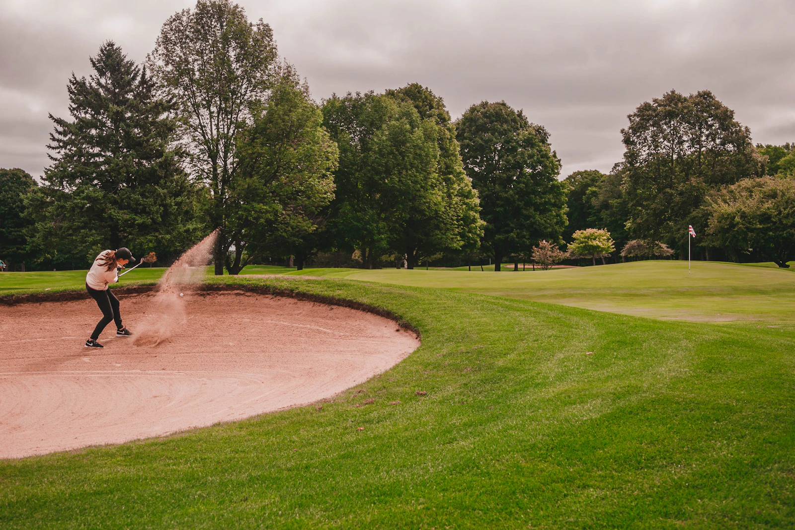 Player playing out of a greenside bunker