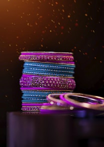 multi colored rubber band on black surface