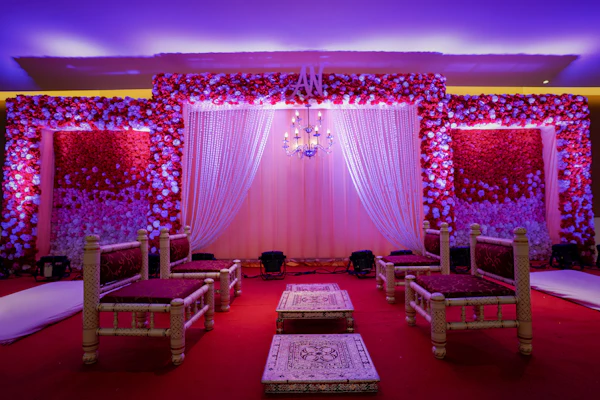 Vibrant red and green seating decor at a wedding venue
