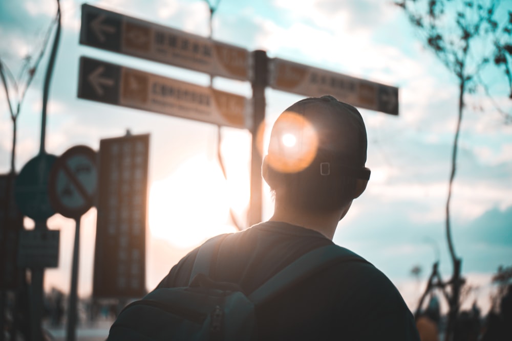 man in black shirt standing during daytime