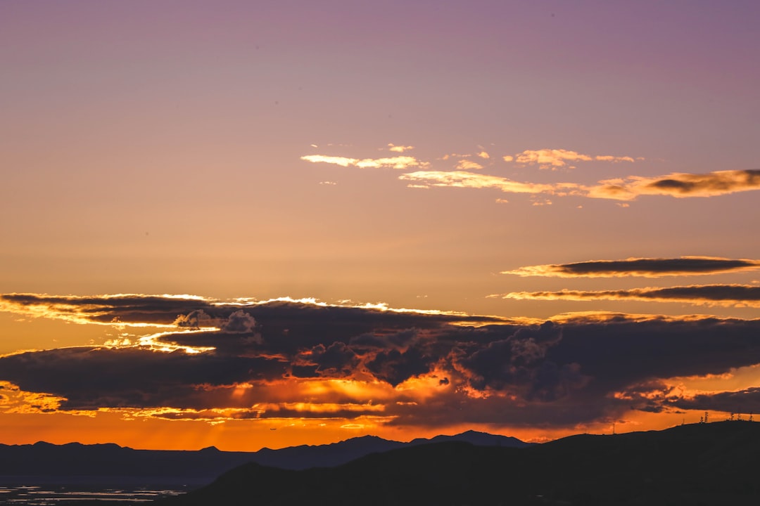 silhouette of mountains during sunset