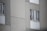 A satisfied customer giving a thumbs up in front of Hazen Industries' office.