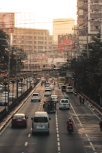 cars on road near buildings during daytime