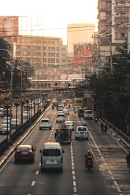 cars on road near buildings during daytime