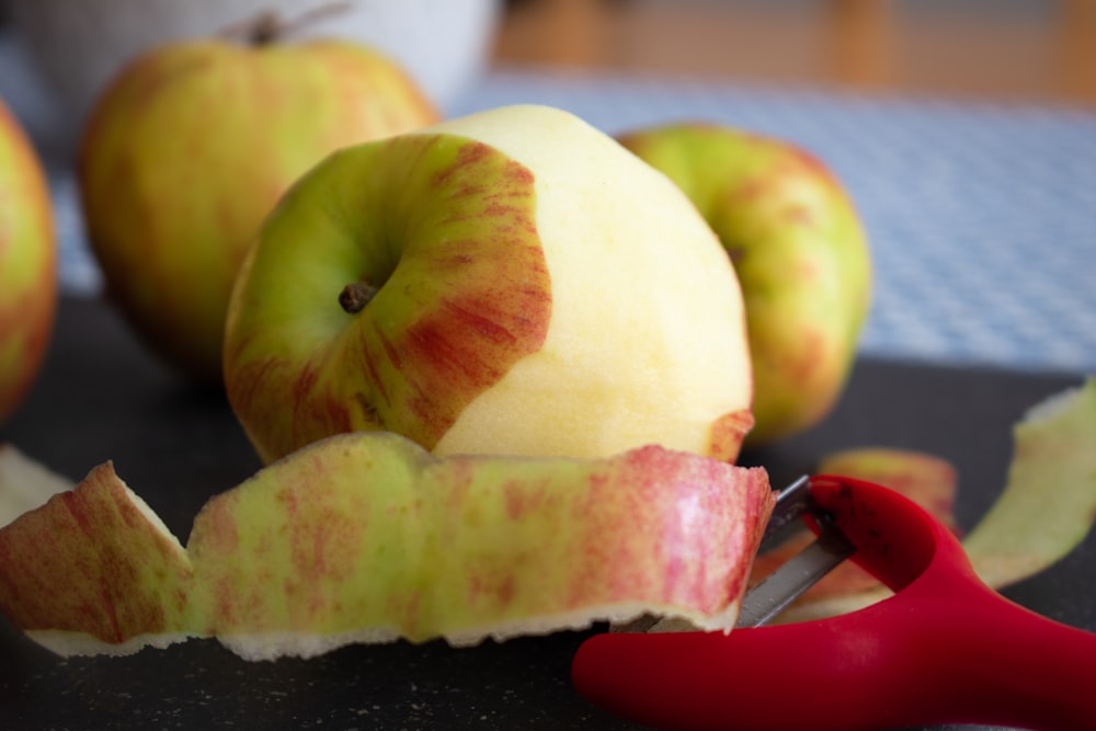 sliced apple fruit on black tray