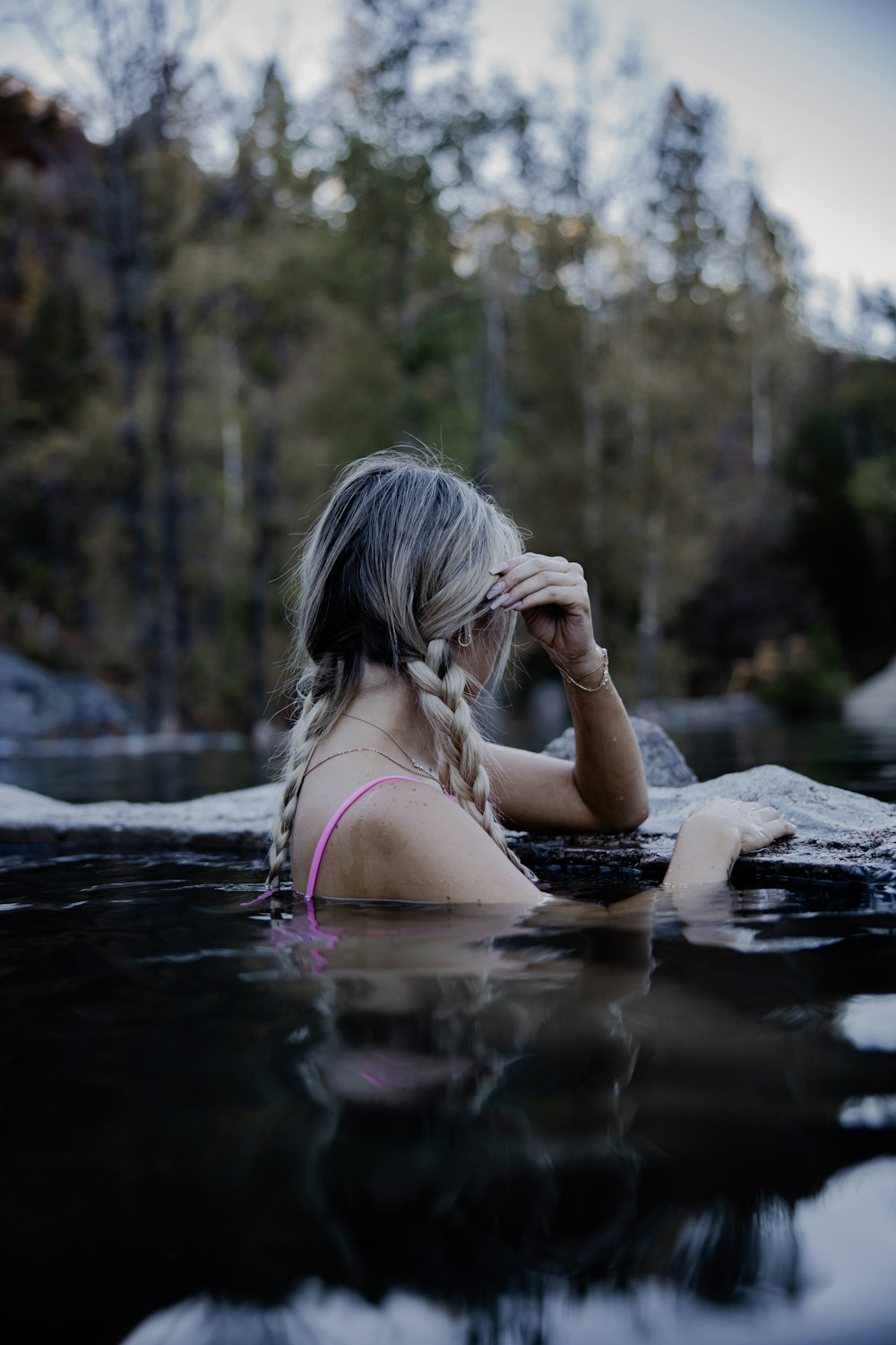 woman in pink bikini on water