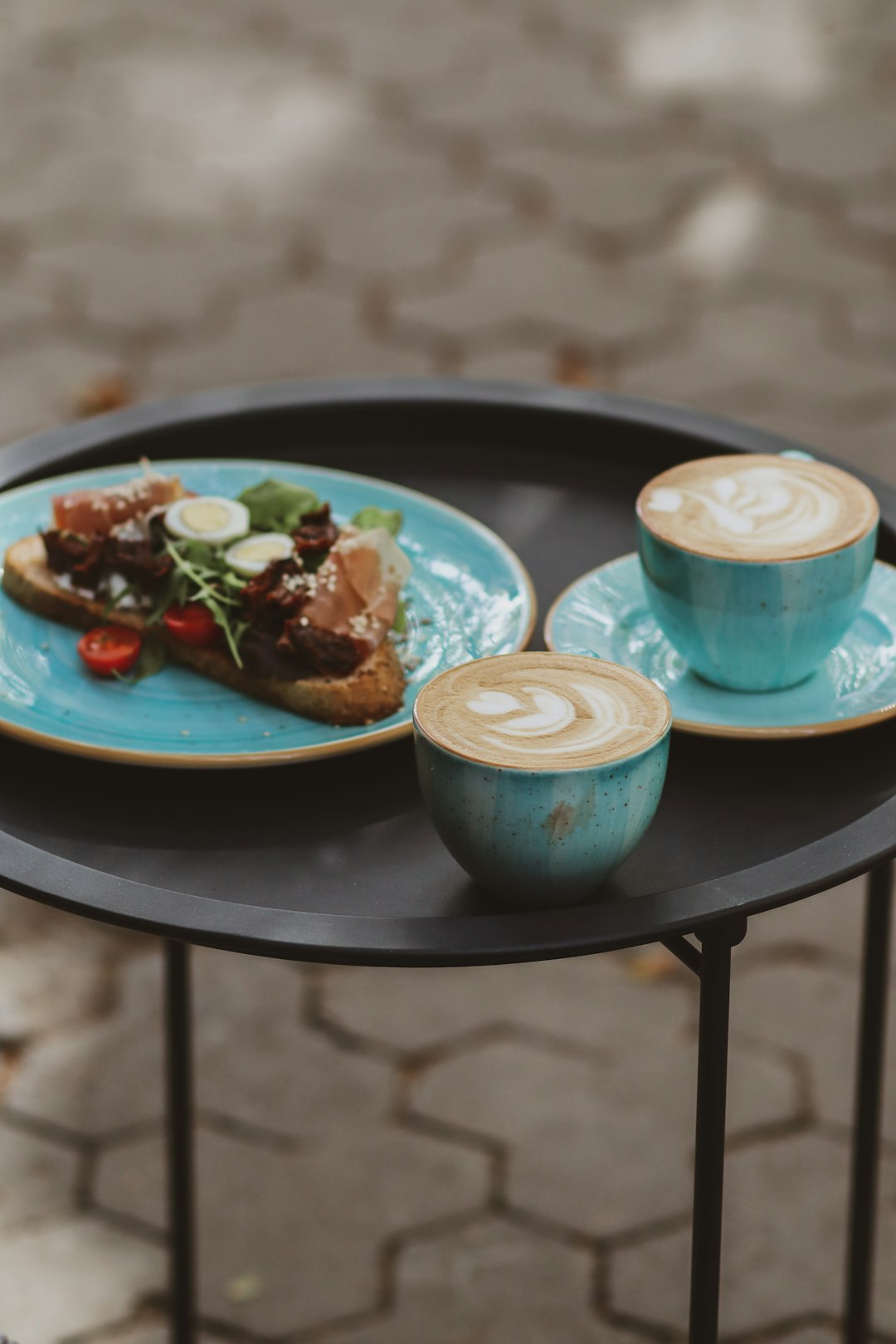 two blue ceramic mugs on blue ceramic plate