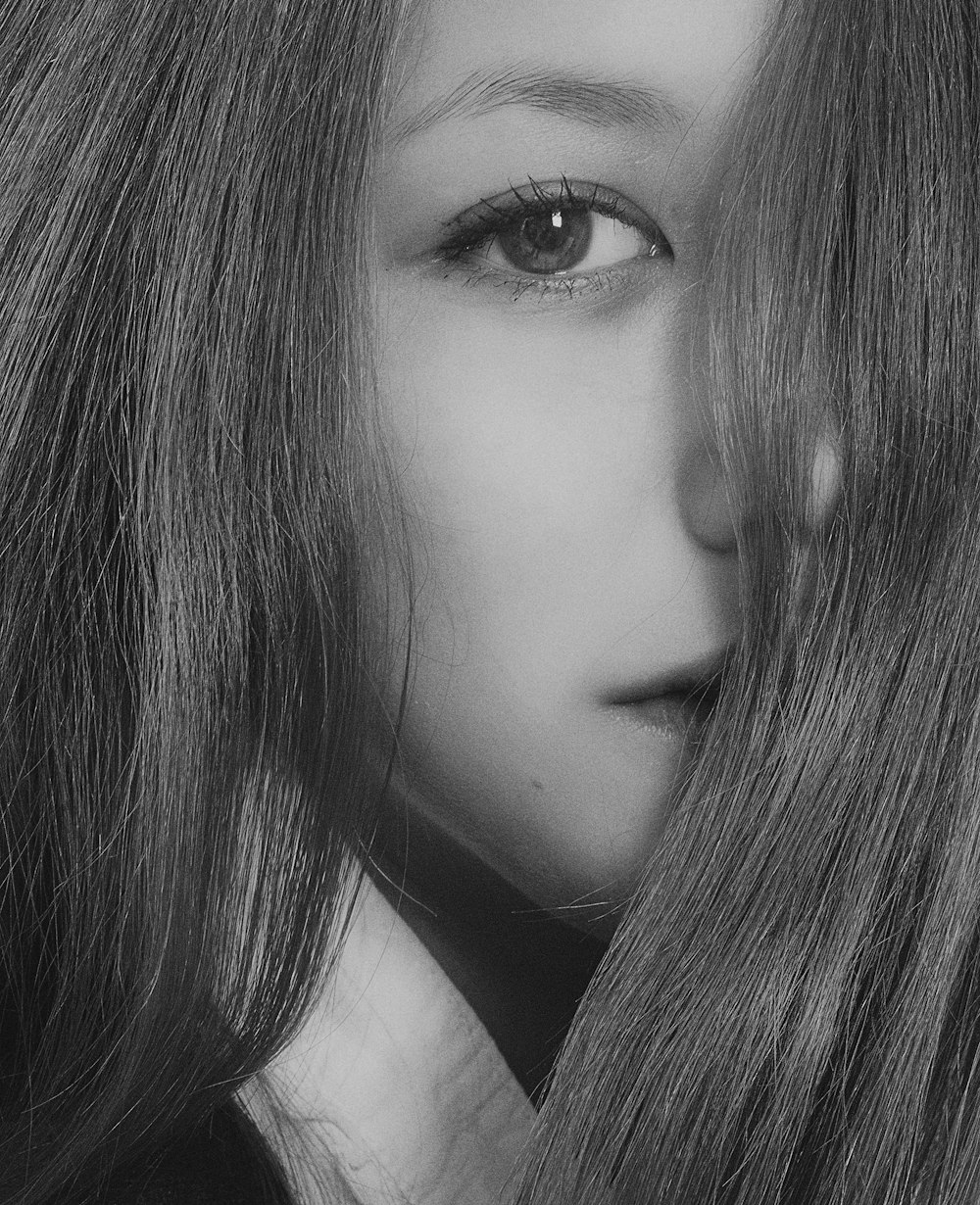 womans face in grayscale