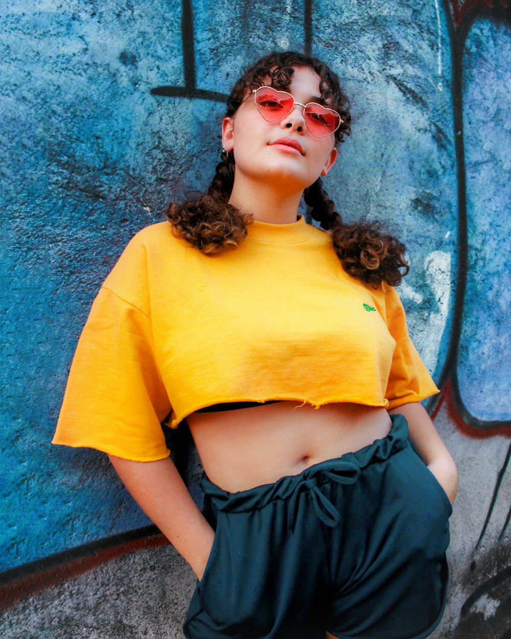 woman in yellow crew neck t-shirt and black skirt