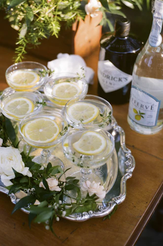 Elegant glass beverage jars on rustic wooden table
