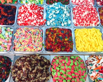 assorted candies in plastic containers