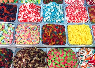 assorted candies in plastic containers