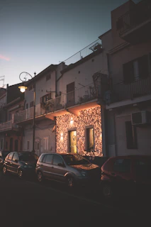 A warm golden-lit street in a cozy neighborhood at dusk.