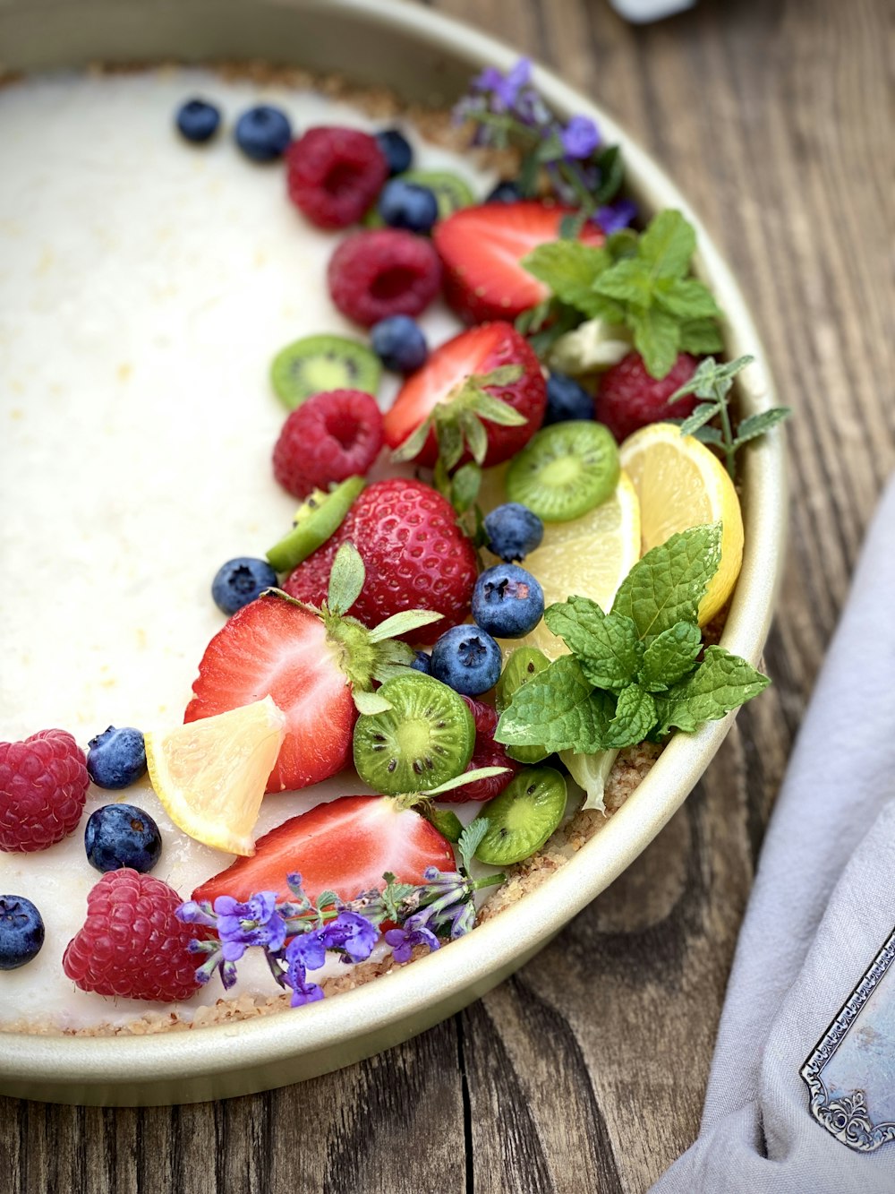 sliced fruits on white ceramic bowl