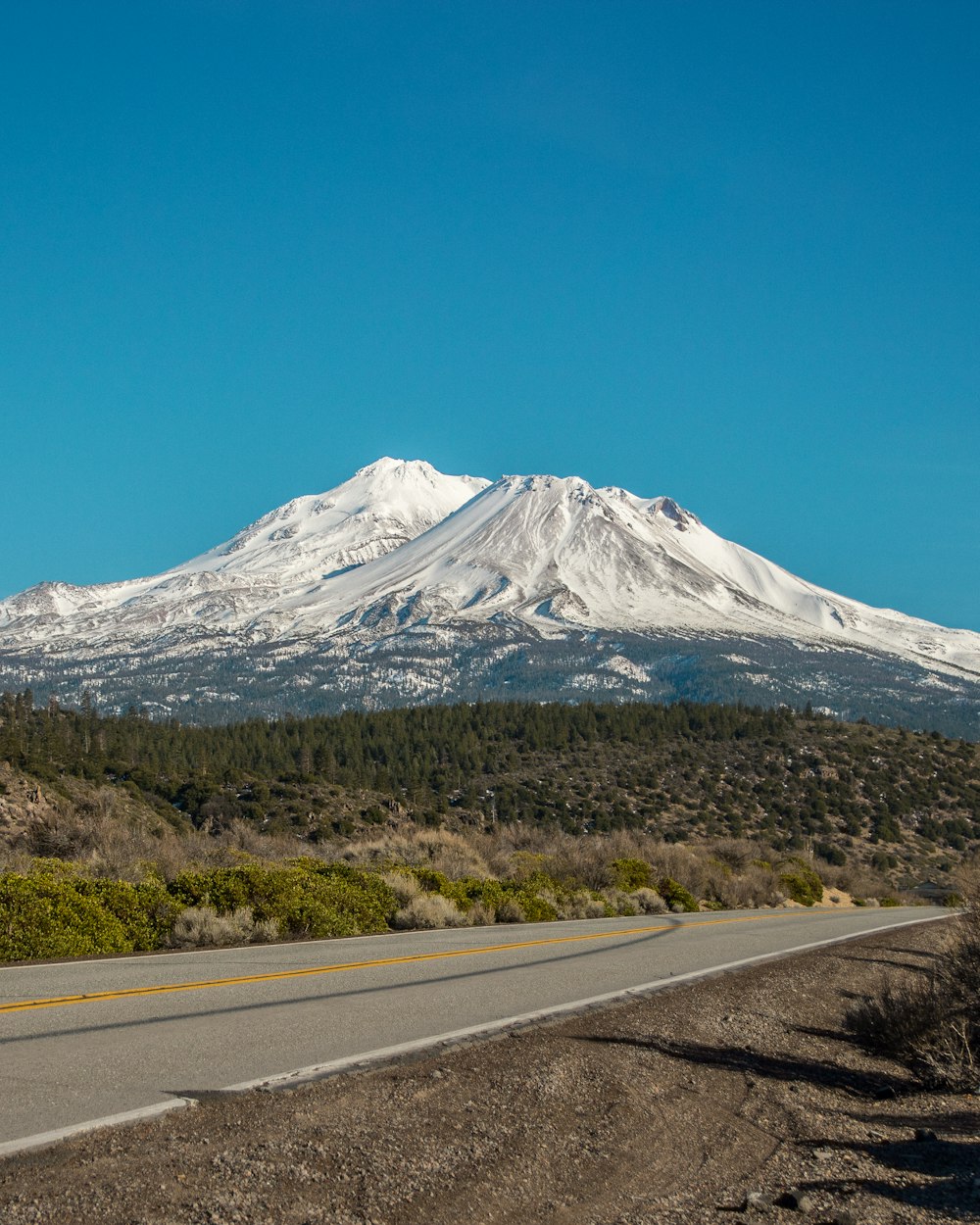 white and black mountain under blue sky during daytime