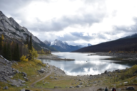 lake in the middle of mountains in Jasper National Park Of Canada Canada