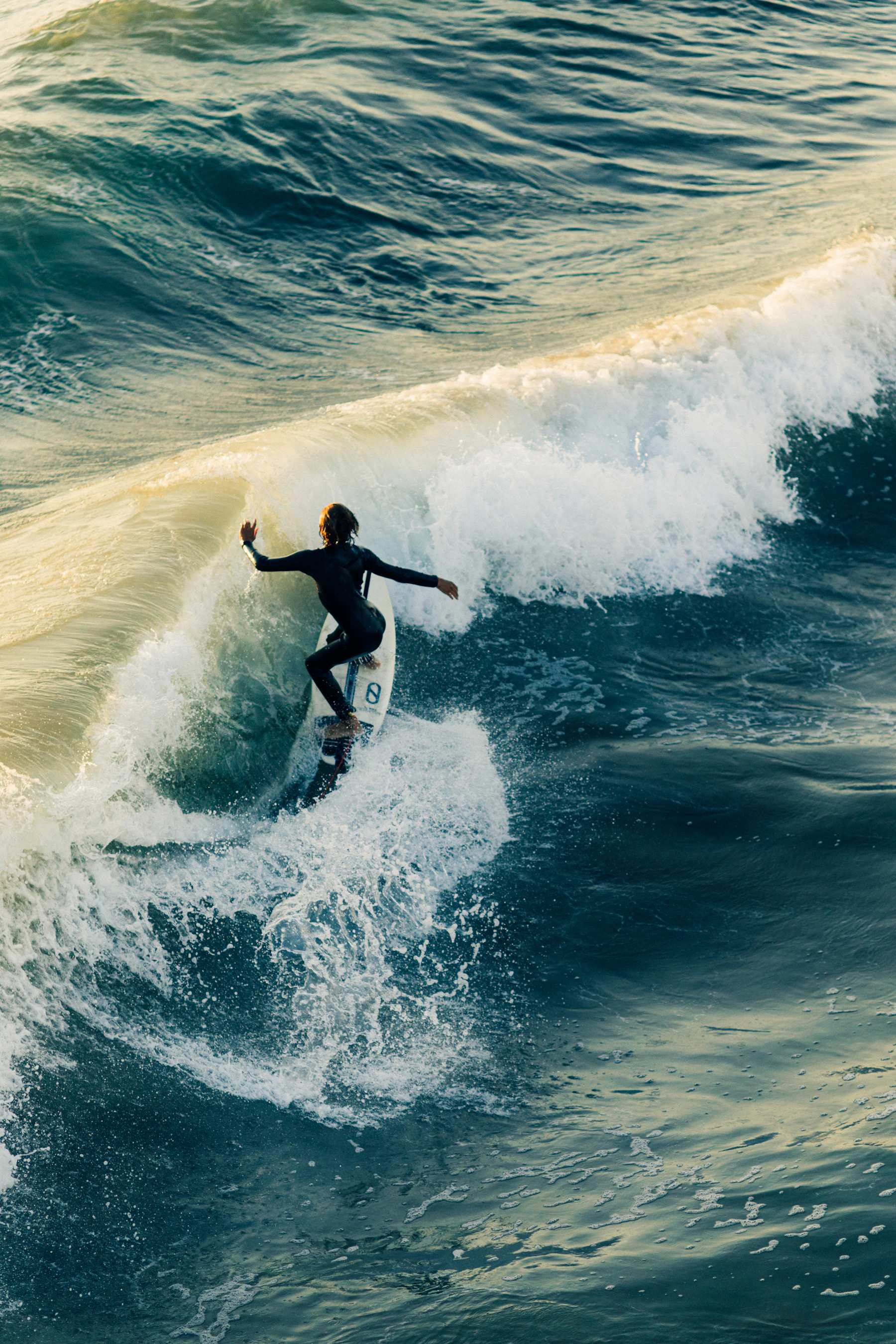 Surfer on a golden wave