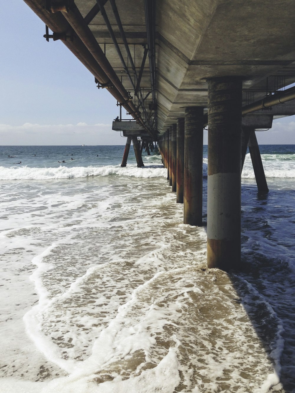 brown wooden dock on sea during daytime