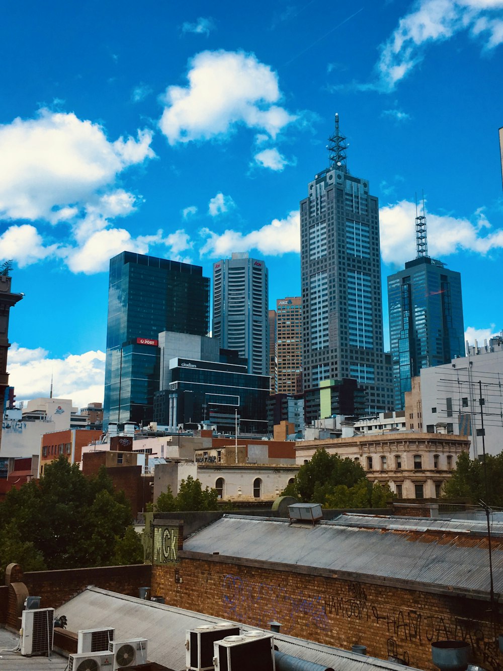 city buildings under blue sky during daytime