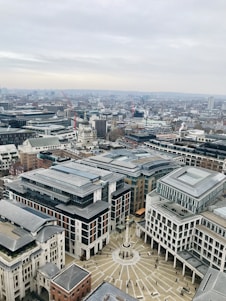 A vibrant aerial view of Vibo Place showcasing Axis Mall, Cebu Grand Hotel, and office buildings bustling with activity.