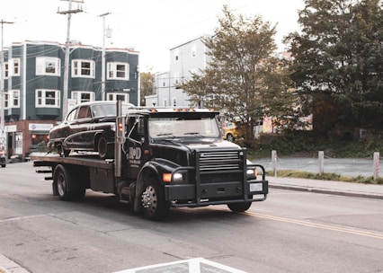 black truck on road during daytime